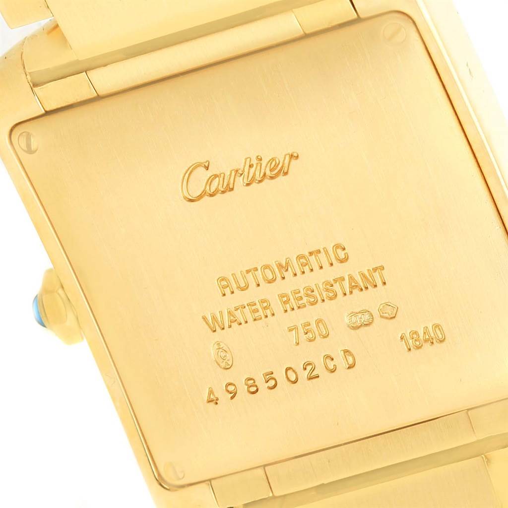 The image shows the back case of a Cartier Tank Francaise W50001R2 Yellow Gold Silver Dial W50001R2 Yellow Gold Silver Dial watch, highlighting its engravings and details.
