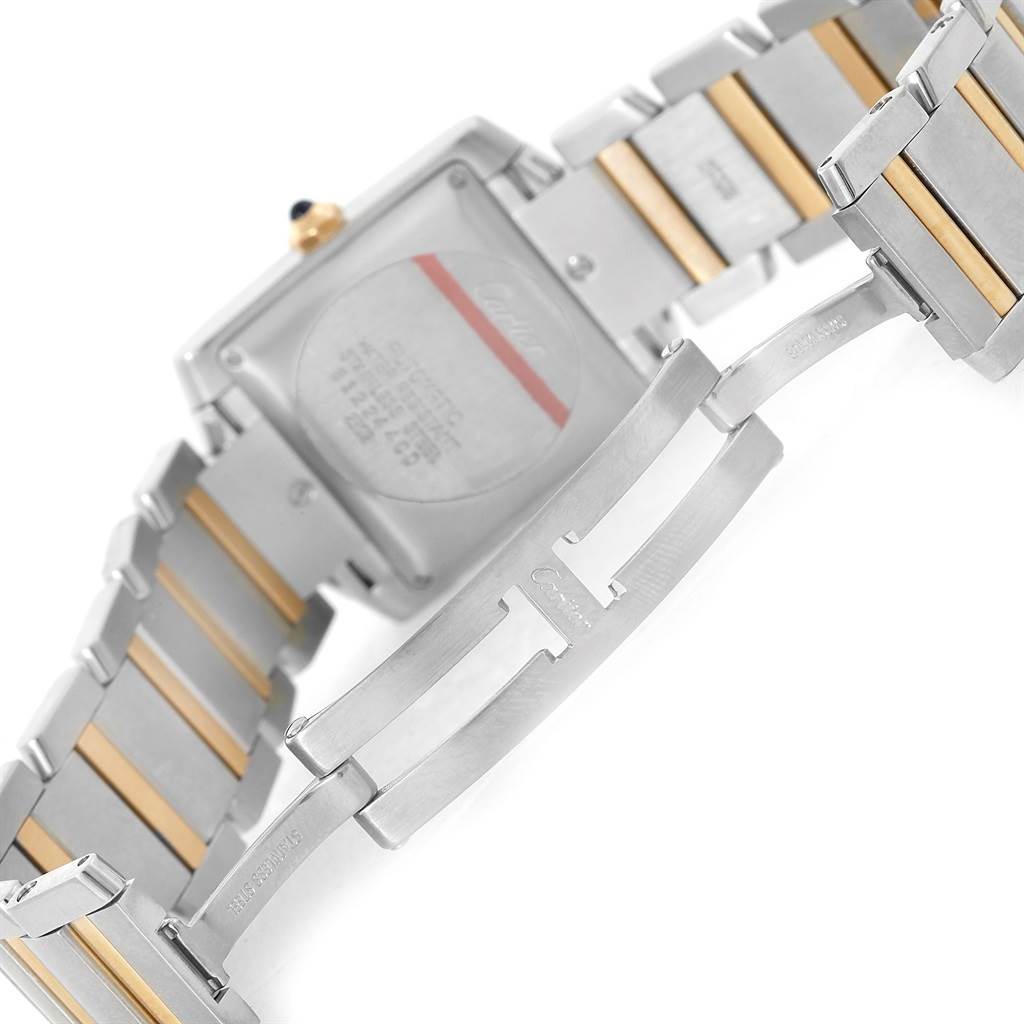 The image shows the back and bracelet of a Cartier Tank Française watch, focusing on the clasp and links.