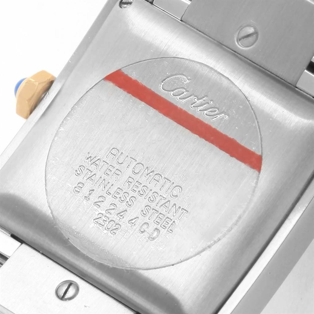 This image shows the back of a Cartier Tank Francaise W51005Q4 Men's Steel and Gold (two tone) Silver Dial W51005Q4 Men's Steel and Gold (two tone) Silver Dial watch, highlighting the engraved details and part of the bracelet.