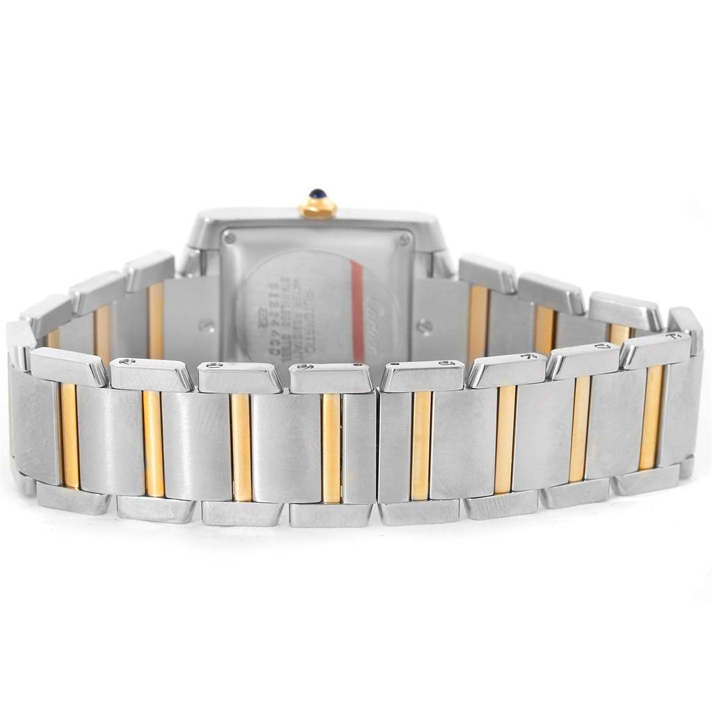 This image shows the Cartier Tank Française watch from the back, highlighting the two-tone bracelet and case back.