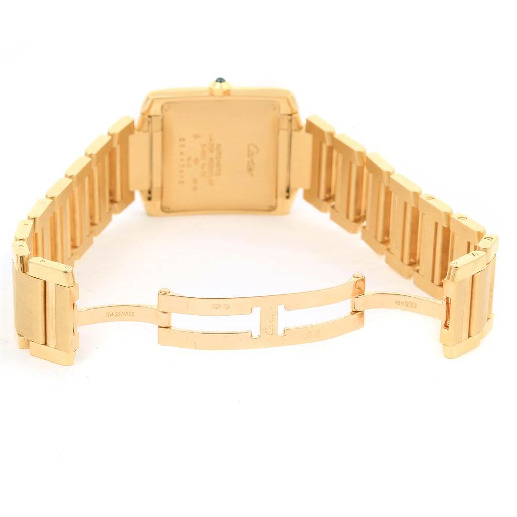 The image shows the back case and bracelet clasp of a Cartier Tank Française watch, viewed from the rear angle.