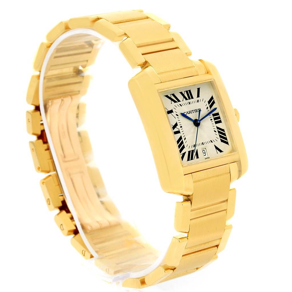 The Cartier Tank Francaise W50001R2 Yellow Gold Silver Dial W50001R2 Yellow Gold Silver Dial watch is shown at a three-quarter angle, displaying its gold rectangular case, bracelet, and white dial with Roman numerals.