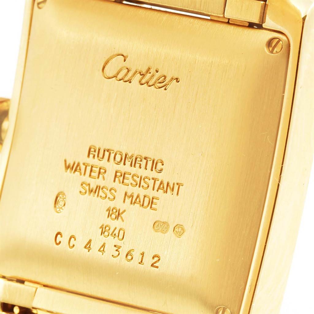 The image shows the back plate of a Cartier Tank Francaise W50001R2 Yellow Gold Silver Dial W50001R2 Yellow Gold Silver Dial watch, featuring engraved text with specifications.