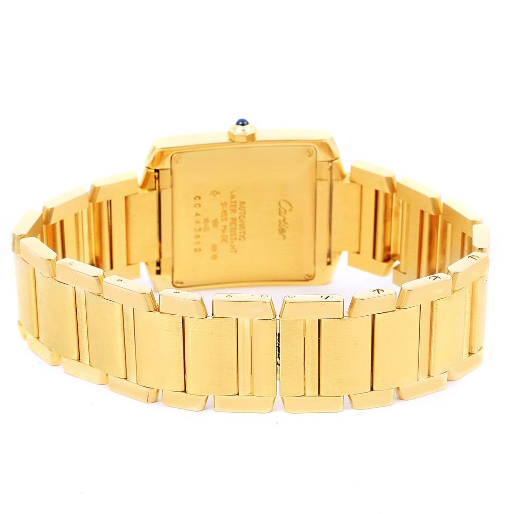 This image shows the back view of a Cartier Tank Francaise W50001R2 Yellow Gold Silver Dial W50001R2 Yellow Gold Silver Dial watch, including its gold square case and linked bracelet.