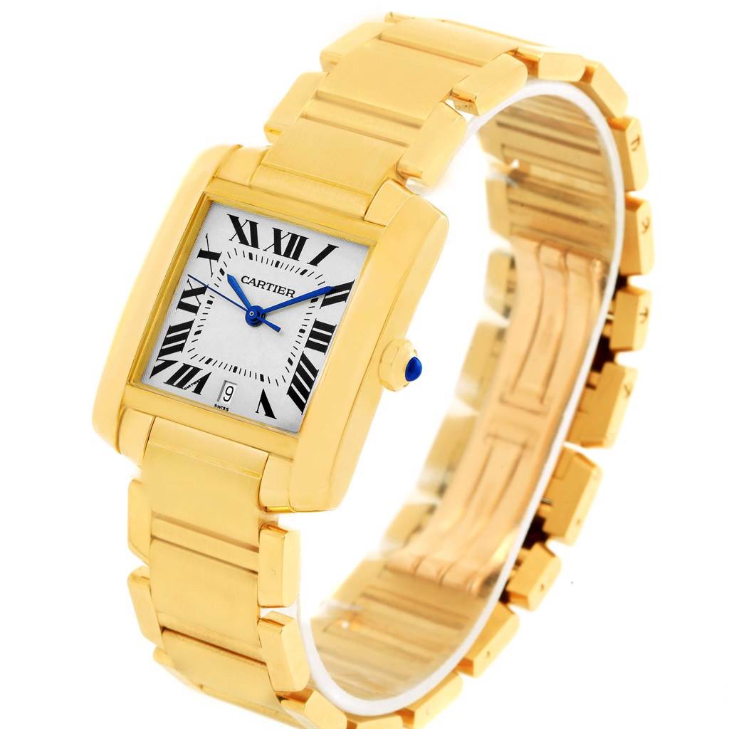 The image shows a Cartier Tank Francaise W50001R2 Yellow Gold Silver Dial W50001R2 Yellow Gold Silver Dial watch from an angled view, highlighting the rectangular face, Roman numerals, and gold bracelet.