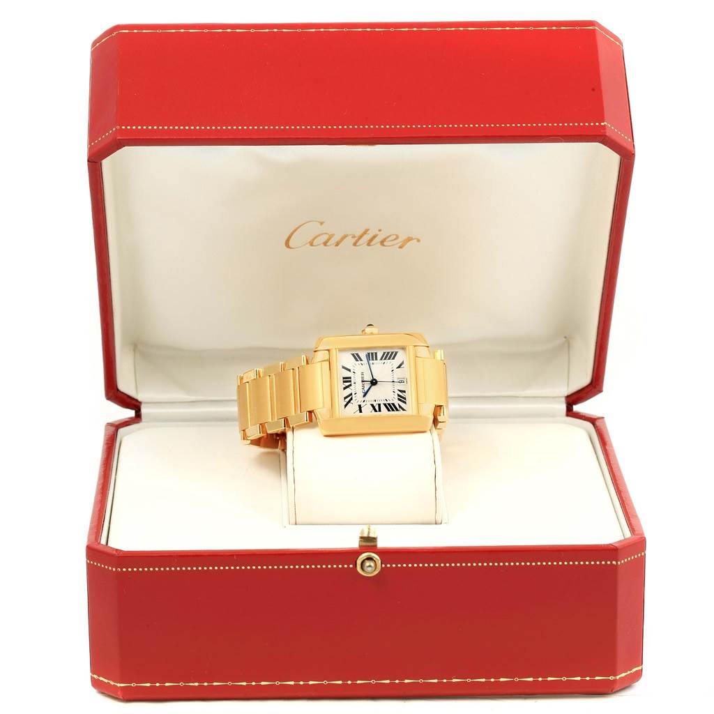 The Cartier Tank Francaise W50001R2 Yellow Gold Silver Dial W50001R2 Yellow Gold Silver Dial watch is shown from a front angle, displayed in an open red case.