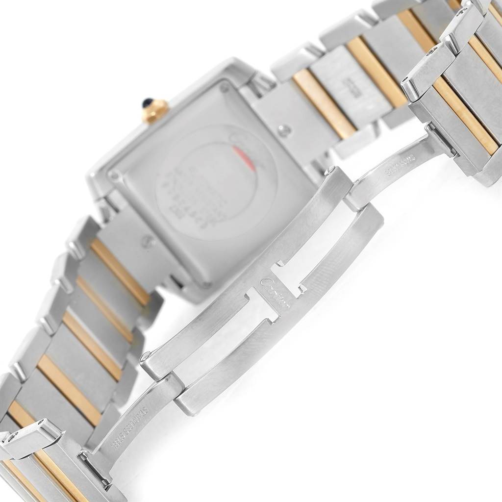The image shows the back and clasp of the Cartier Tank Francaise W51005Q4 Steel and Gold (two tone) Silver Dial W51005Q4 Steel and Gold (two tone) Silver Dial watch, highlighting its metal and gold two-tone bracelet.