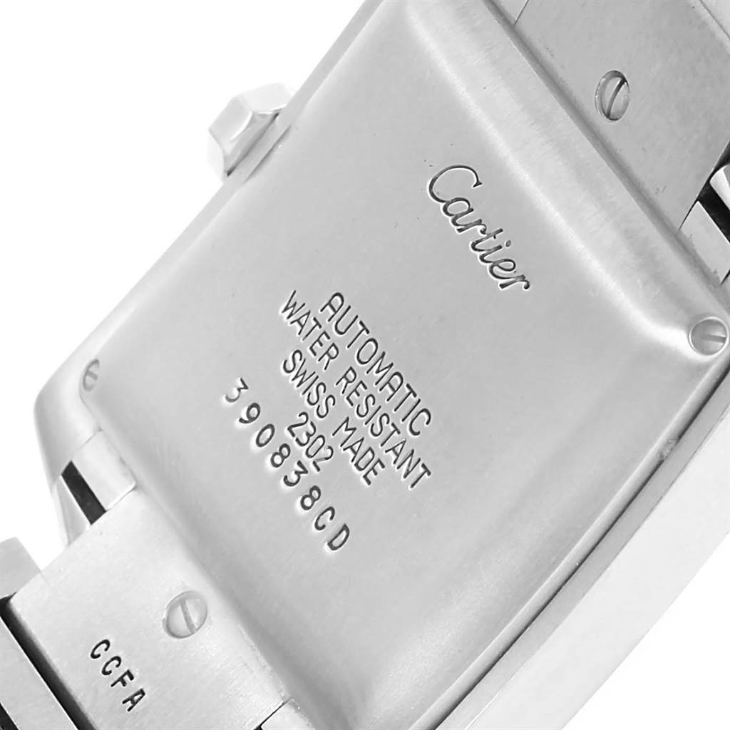 The image shows the back of a Cartier Tank Francaise W51002Q3 Stainless Steel Silver Dial W51002Q3 Stainless Steel Silver Dial watch, detailing its engravings and part of the metal bracelet.