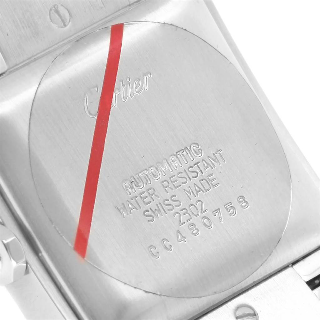 The image shows the back case of a Cartier Tank Française watch, highlighting its engravings and strap connection.