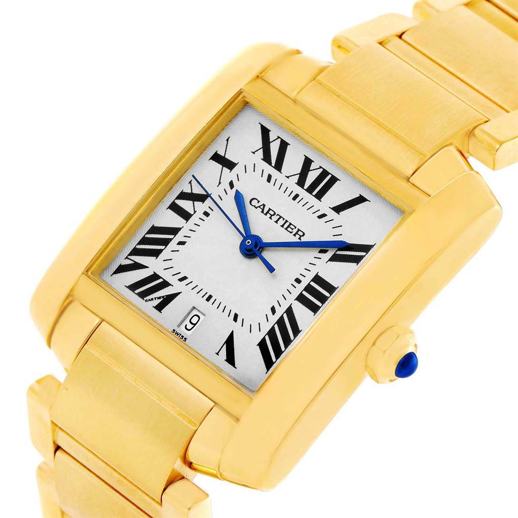 This image shows a gold Cartier Tank Francaise W50001R2 Yellow Gold Silver Dial W50001R2 Yellow Gold Silver Dial watch at a close angle, highlighting the face, bezel, bracelet, and crown.