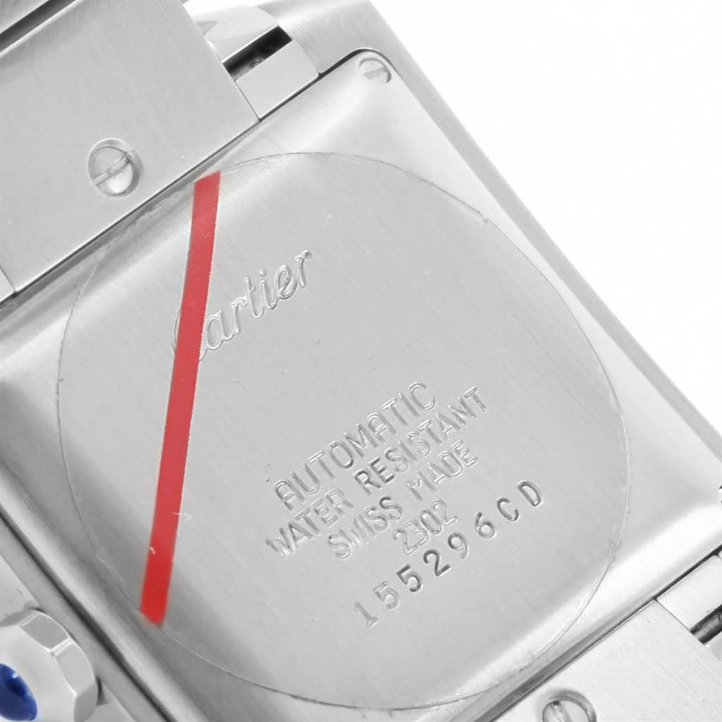 The image shows the back case and part of the bracelet of a Cartier Tank Francaise W51002Q3 Stainless Steel Silver Dial W51002Q3 Stainless Steel Silver Dial watch, highlighting its engravings.