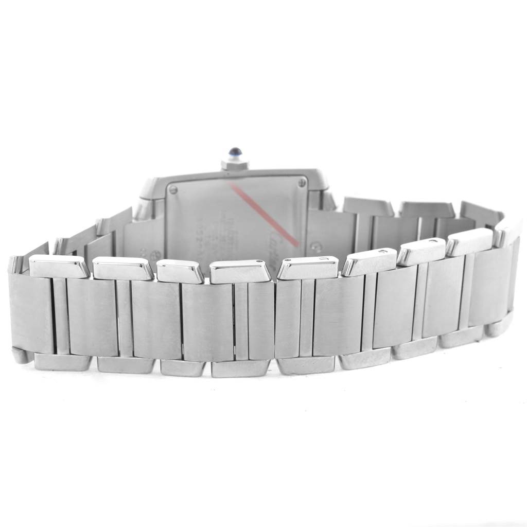 The image shows the back and bracelet of a Cartier Tank Française watch, highlighting the metal links and case back.