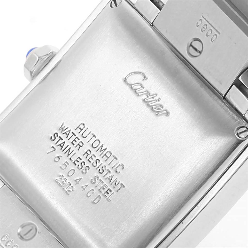 This image shows the back case of a Cartier Tank Francaise W51002Q3 Stainless Steel Silver Dial W51002Q3 Stainless Steel Silver Dial watch, displaying inscriptions about its features and serial number.