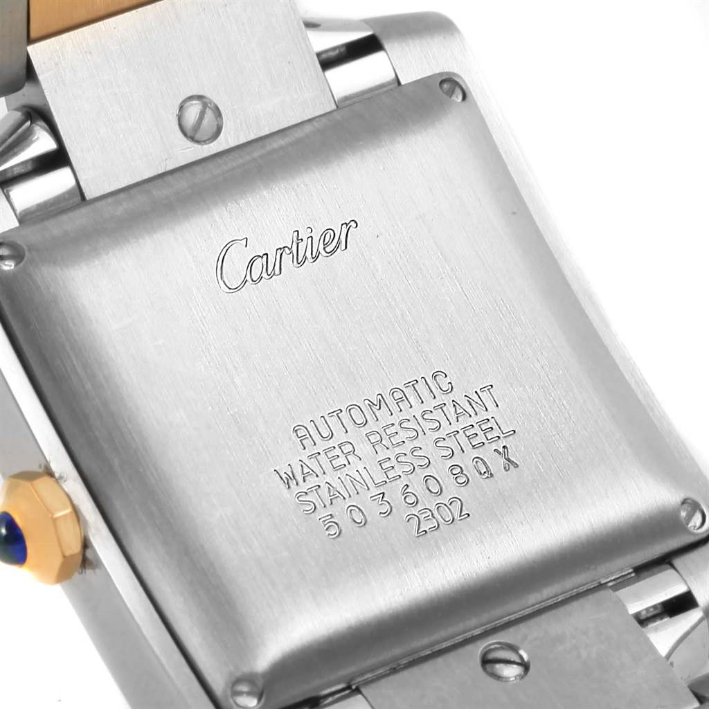 The image shows the case back of a Cartier Tank Francaise W51005Q4 Men's Steel and Gold (two tone) Silver Dial W51005Q4 Men's Steel and Gold (two tone) Silver Dial watch, featuring engraved brand inscriptions and specifications.