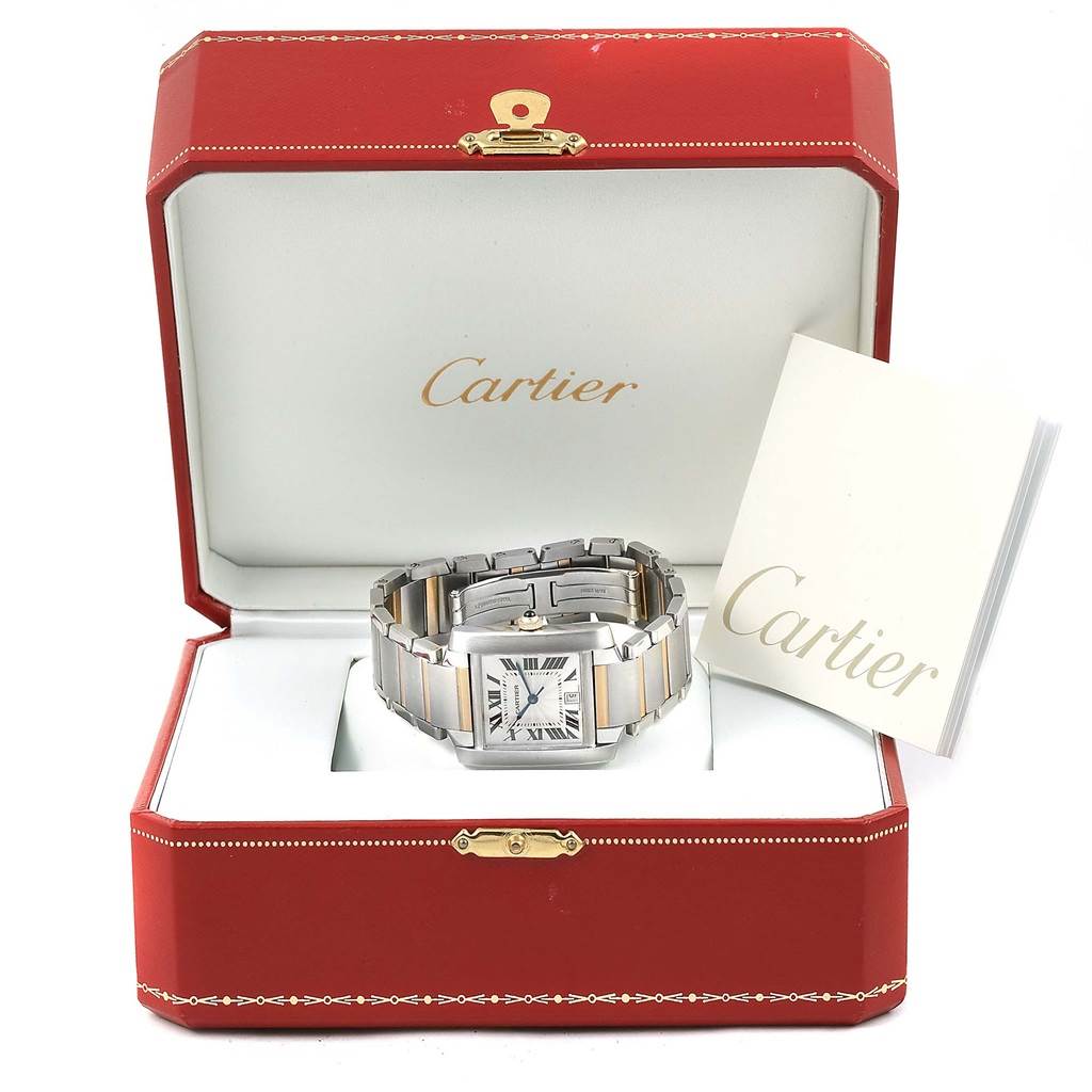 The Cartier Tank Francaise W51005Q4 Men's Steel and Gold (two tone) Silver Dial W51005Q4 Men's Steel and Gold (two tone) Silver Dial watch is shown in an open box with a booklet on the side.