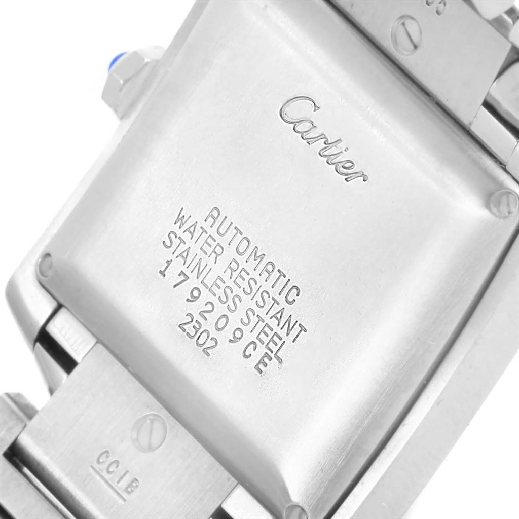The image shows the back case of a Cartier Tank Française watch, displaying details such as "Automatic" and "Water Resistant".