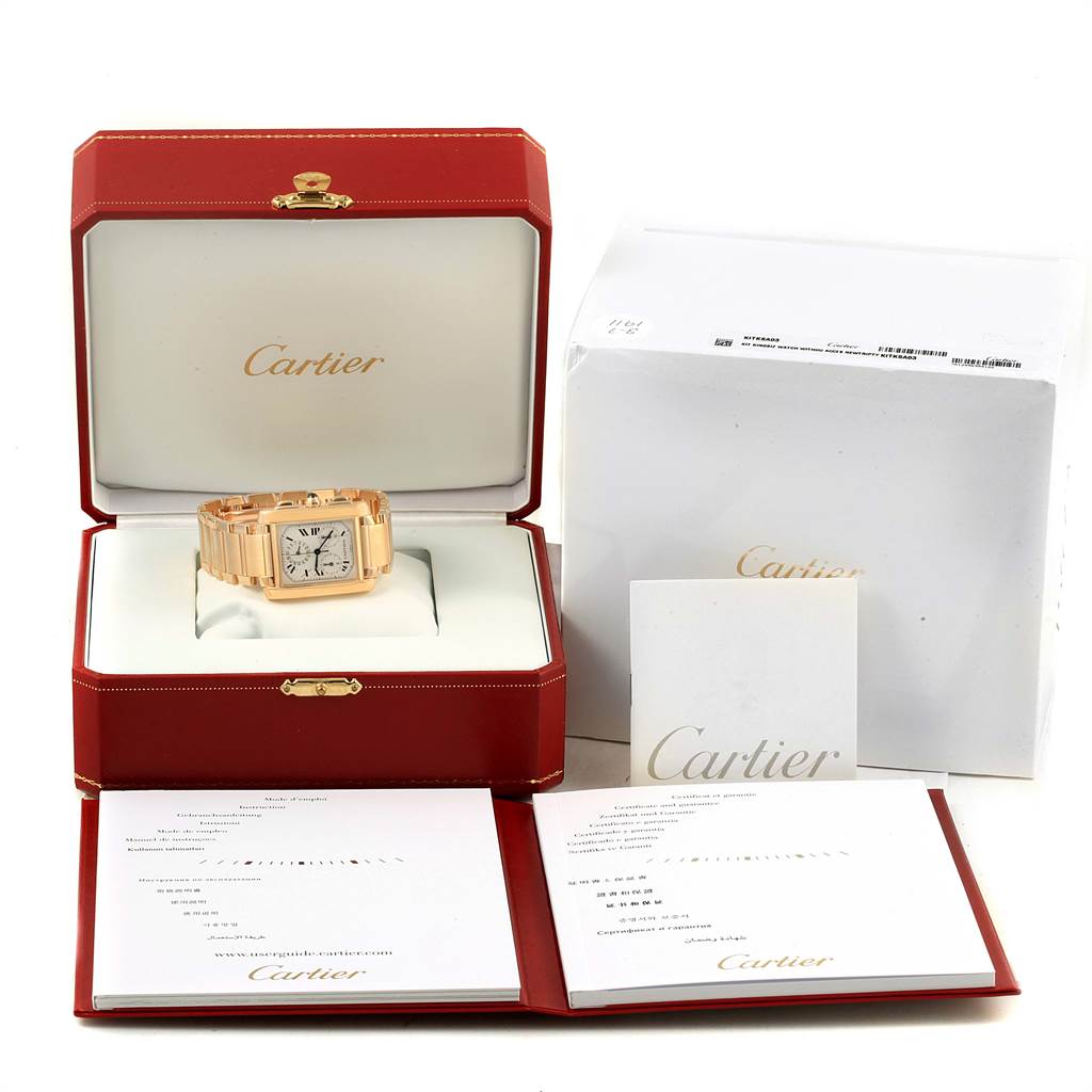 The Cartier Tank Francaise W50005R2 Men
s Yellow Gold Silver Dial W50005R2 Men
s Yellow Gold Silver Dial watch is shown in its open box, accompanied by its packaging and documentation.