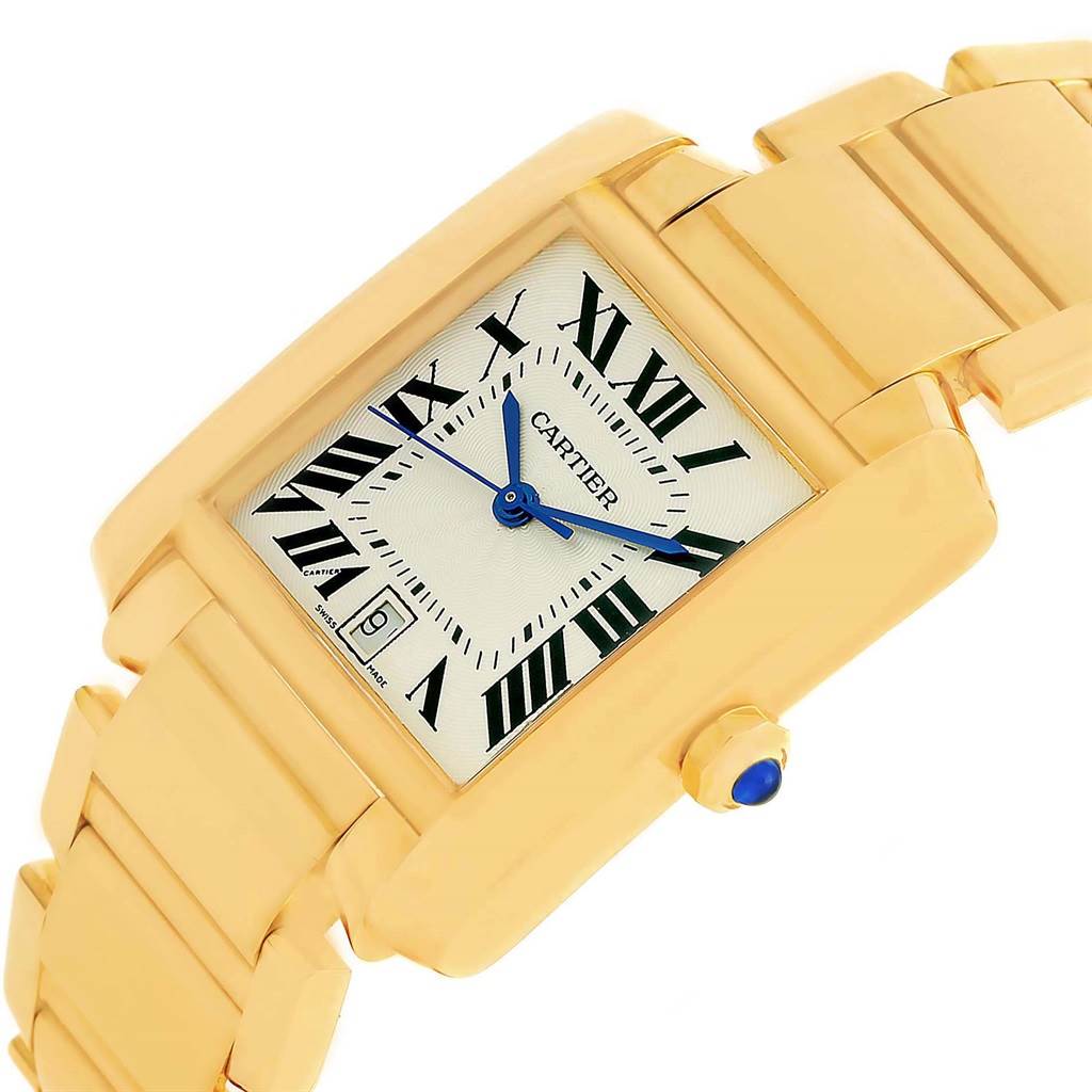 The image shows a close-up of a Cartier Tank Francaise W50001R2 Men's Yellow Gold Silver Dial W50001R2 Men's Yellow Gold Silver Dial watch, angled to display the dial and part of the bracelet.