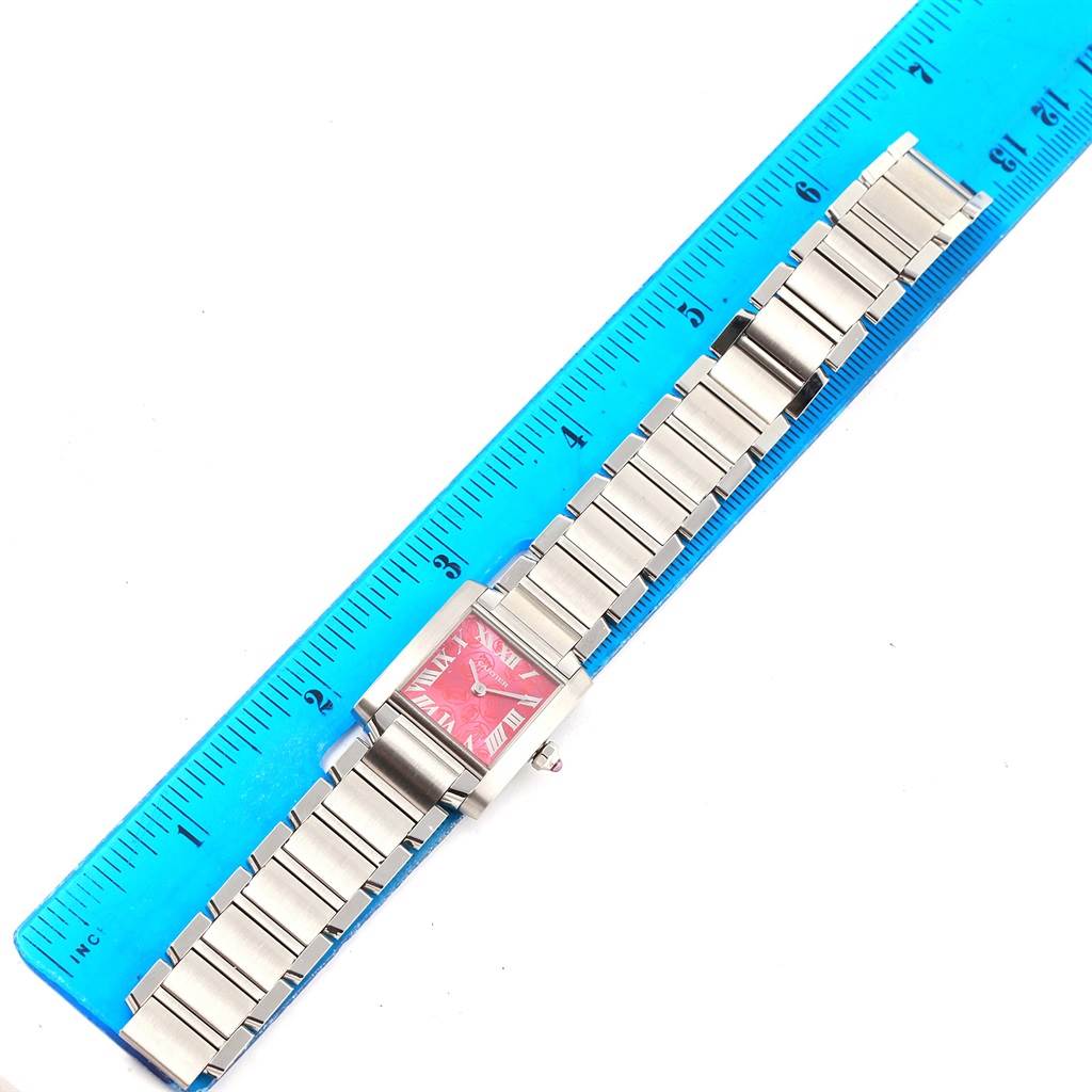 The image shows a Cartier Tank Francaise W51030Q3 Women's Stainless Steel White Dial W51030Q3 Women's Stainless Steel White Dial watch with a full view of the band and face, next to a blue ruler for scale.