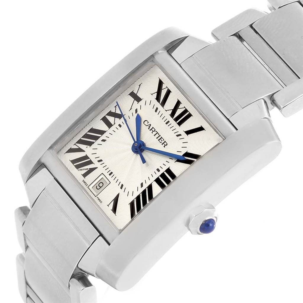 This image shows a Cartier Tank Francaise W51002Q3 Men's Stainless Steel Silver Dial W51002Q3 Men's Stainless Steel Silver Dial watch at a tilted angle, highlighting its face, Roman numerals, date window, and part of the bracelet.