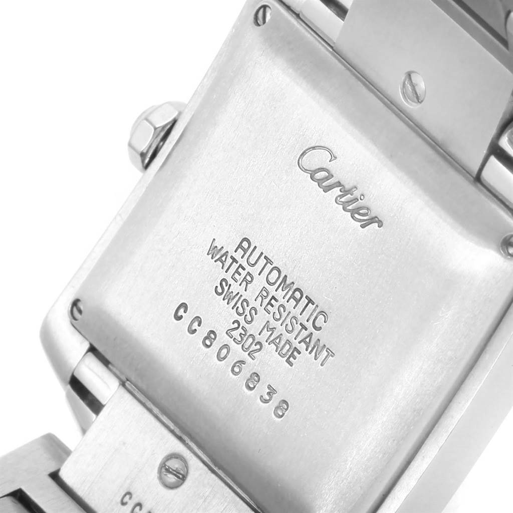 This image shows the back of a Tank Francaise model by Cartier, highlighting the inscription and watch links.
