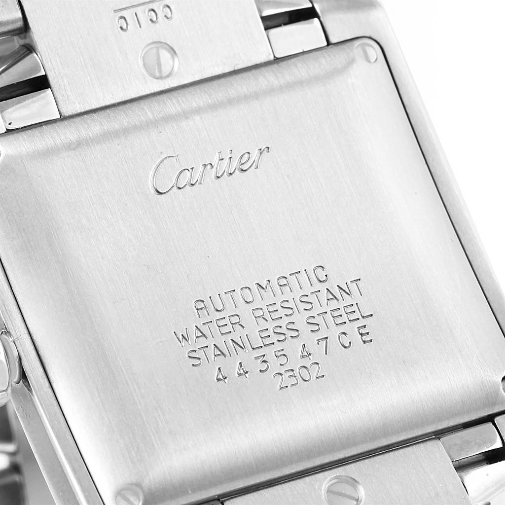 This image shows the back of a Cartier Tank Française watch in stainless steel, detailing water resistance, automatic movement, and other inscriptions.