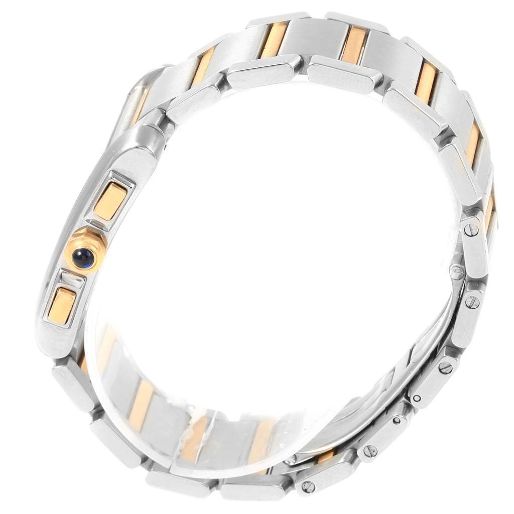 This image shows a side view of a Cartier Tank Française watch, focusing on its metal bracelet with gold accents and the crown.