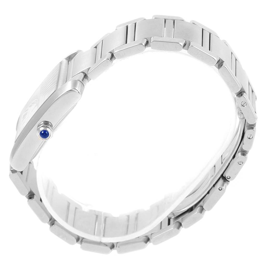 This image shows a side view of a Cartier Tank Française watch, highlighting its bracelet and crown with a blue cabochon.