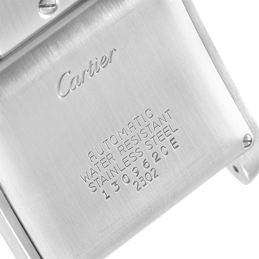 The image shows the back case of a Cartier Tank Française watch, displaying engraving details.