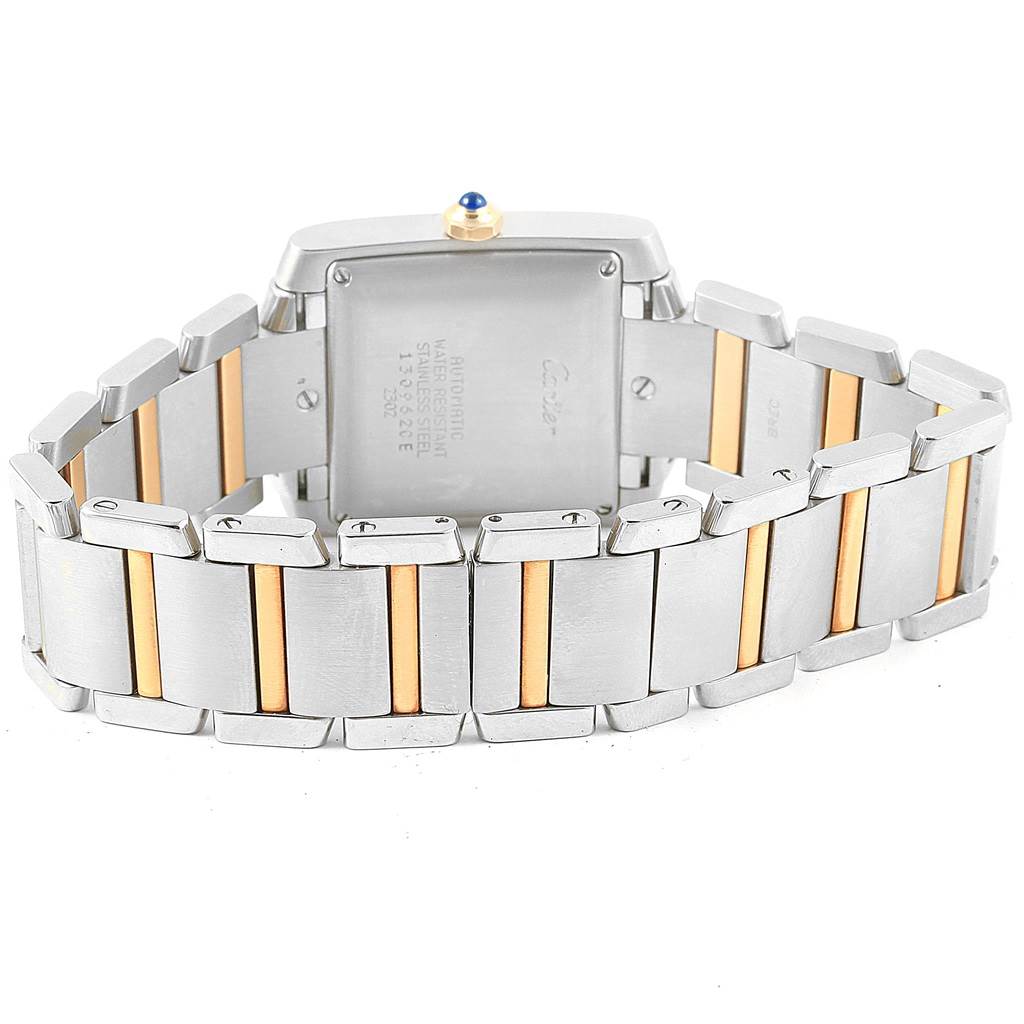 The image shows the back and bracelet of a Cartier Tank Francaise W51005Q4 Men's Steel and Gold (two tone) Silver Dial W51005Q4 Men's Steel and Gold (two tone) Silver Dial watch, highlighting its two-tone metal links.