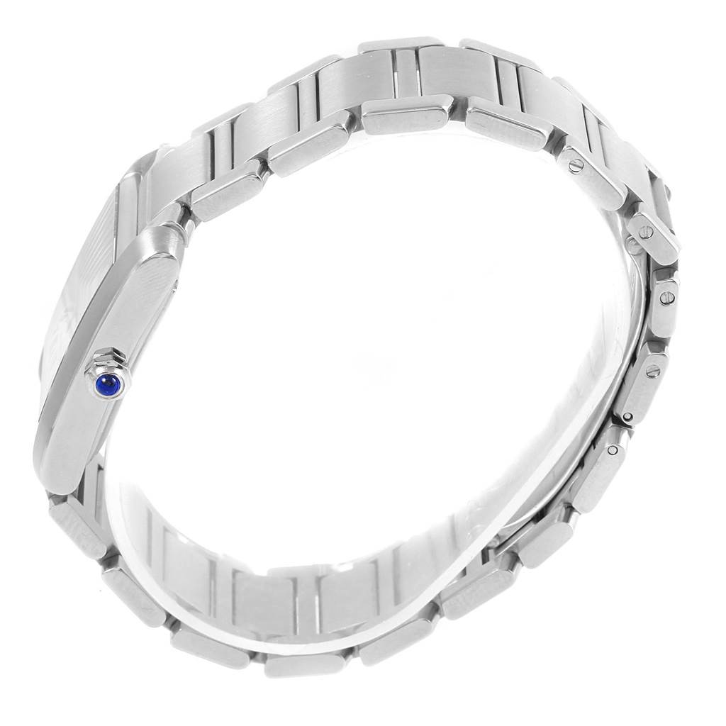 The image shows a side view of the Cartier Tank Francaise W51002Q3 Stainless Steel Silver Dial W51002Q3 Stainless Steel Silver Dial watch, highlighting its metal bracelet and crown with a blue gem.