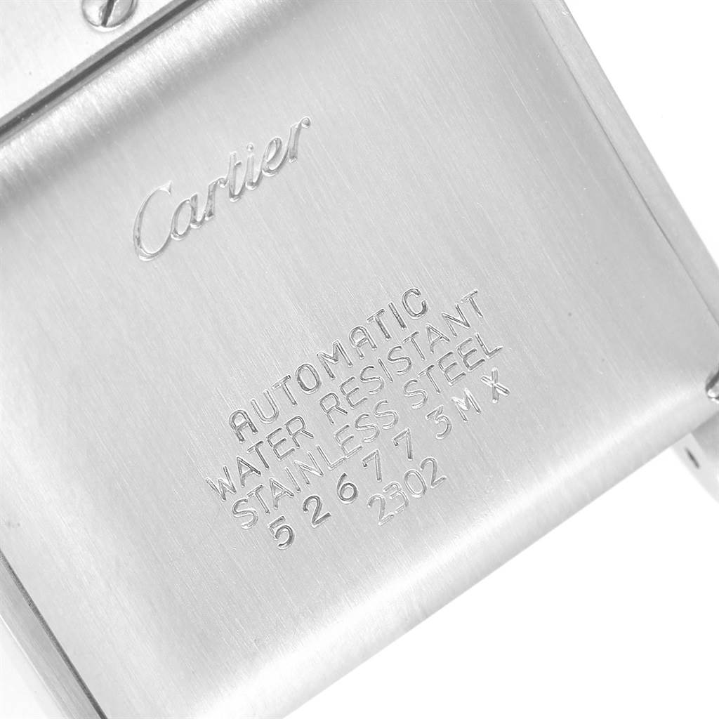 This image shows the back of a Tank Francaise model watch by Cartier, featuring brand engraving and technical specifications.