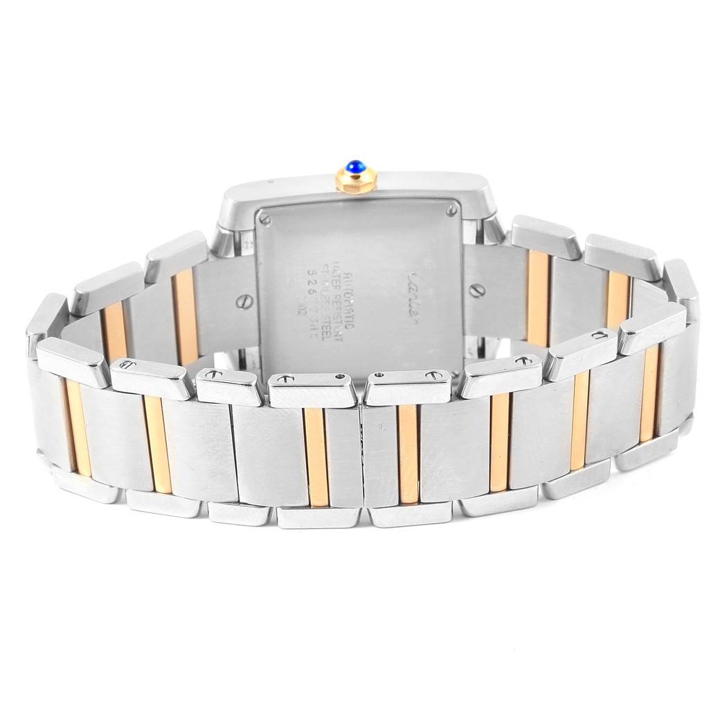 The angle shows the back of the Tank Francaise watch by Cartier, highlighting its two-tone metal bracelet.