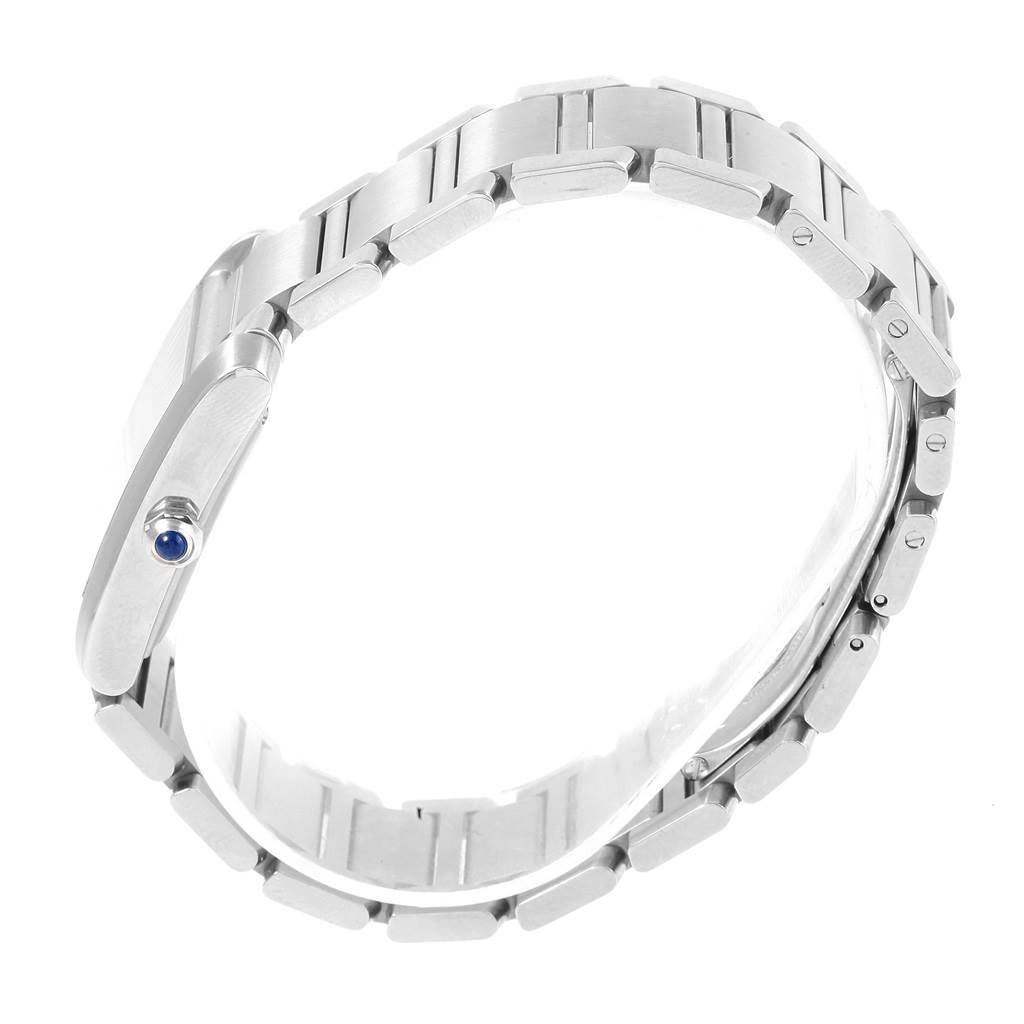 The image shows a side view of the Cartier Tank Francaise W51002Q3 Men's Stainless Steel Silver Dial W51002Q3 Men's Stainless Steel Silver Dial watch, featuring its metallic bracelet and crown with a blue cabochon.