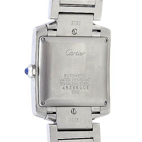 The image shows the back case of a Cartier Tank Française watch, highlighting its stainless steel casing and bracelet.