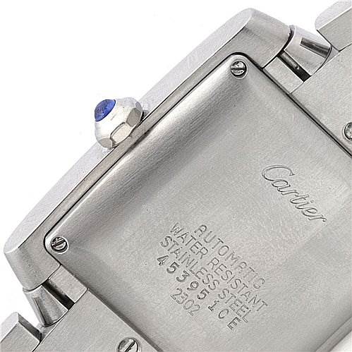 This image shows the back case and part of the bracelet of the Cartier Tank Francaise W51002Q3 Stainless Steel Silver Dial W51002Q3 Stainless Steel Silver Dial watch, highlighting its details and inscriptions.