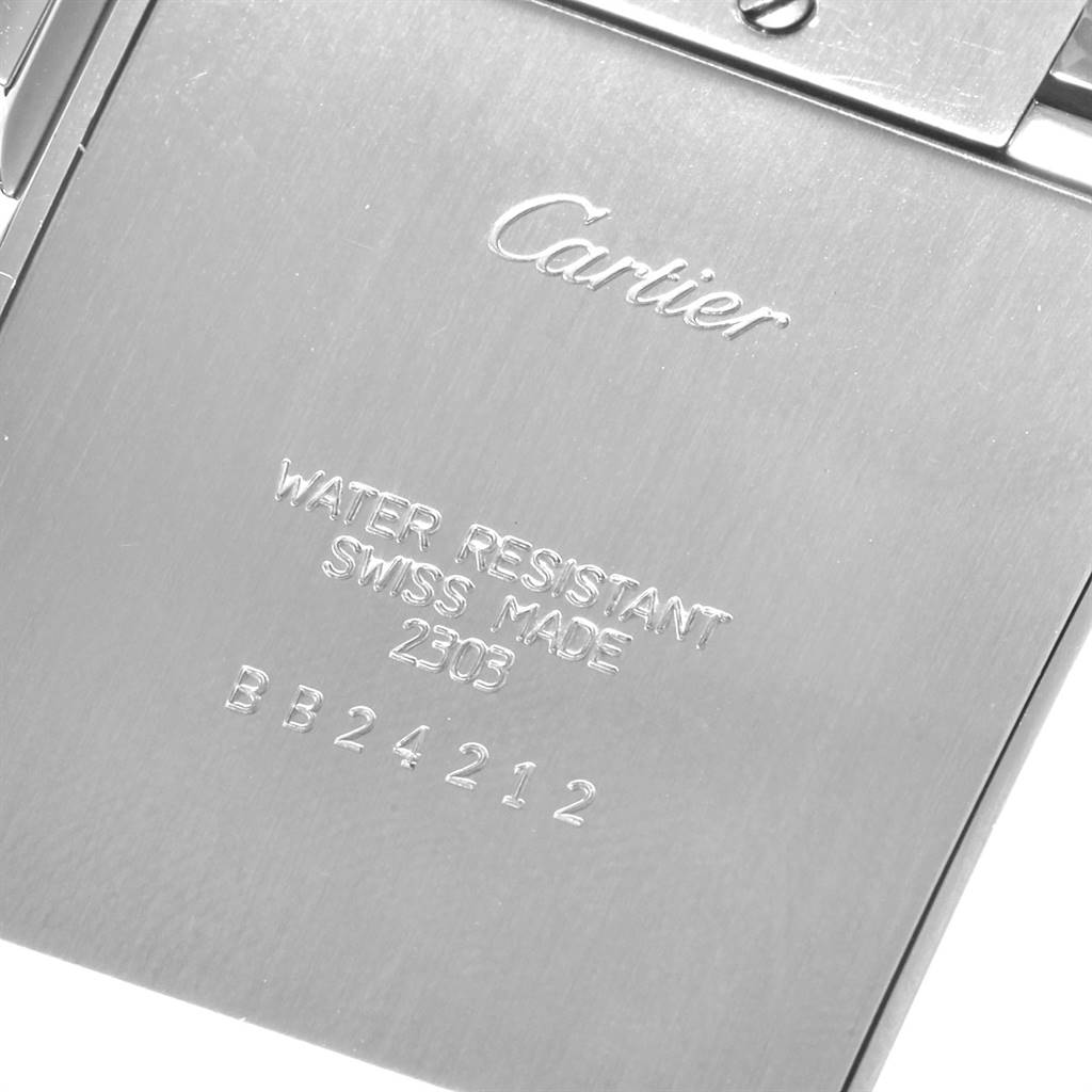 This image shows the back case of a Cartier Tank Française watch, displaying the brand name, water resistance, and serial number.