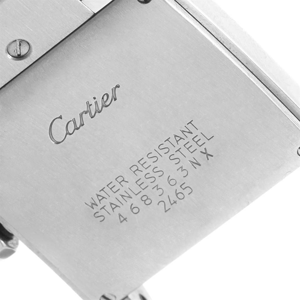This image shows the back case of a Cartier Tank Française watch, highlighting the brand, model, and material details.