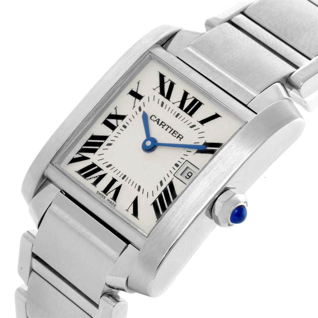 The image shows a close-up of the Cartier Tank Francaise W51011Q3 Men
s Stainless Steel Silver Dial W51011Q3 Men
s Stainless Steel Silver Dial watch at a tilted angle, highlighting its face, crown, and bracelet.