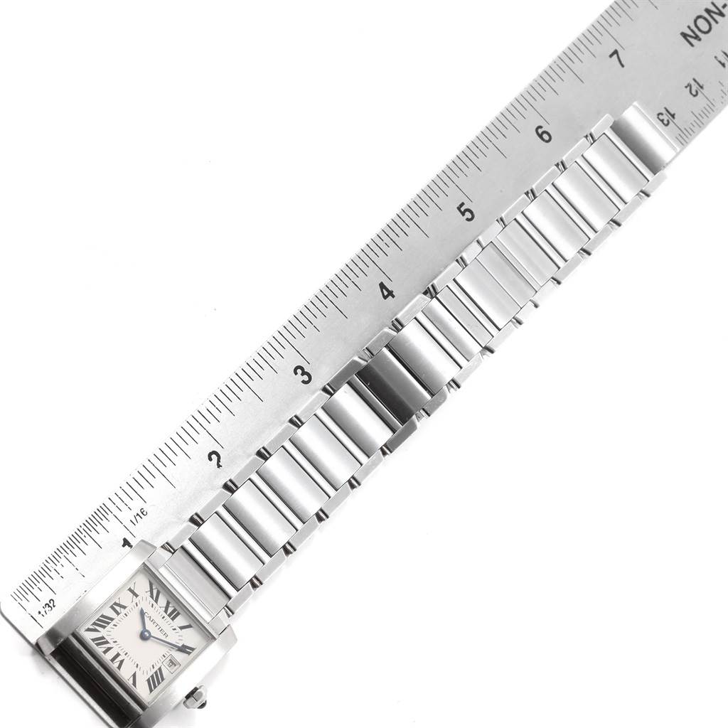 The image shows the face and bracelet of a Cartier Tank Francaise W51011Q3 Men
s Stainless Steel Silver Dial W51011Q3 Men
s Stainless Steel Silver Dial watch, measured against a ruler.