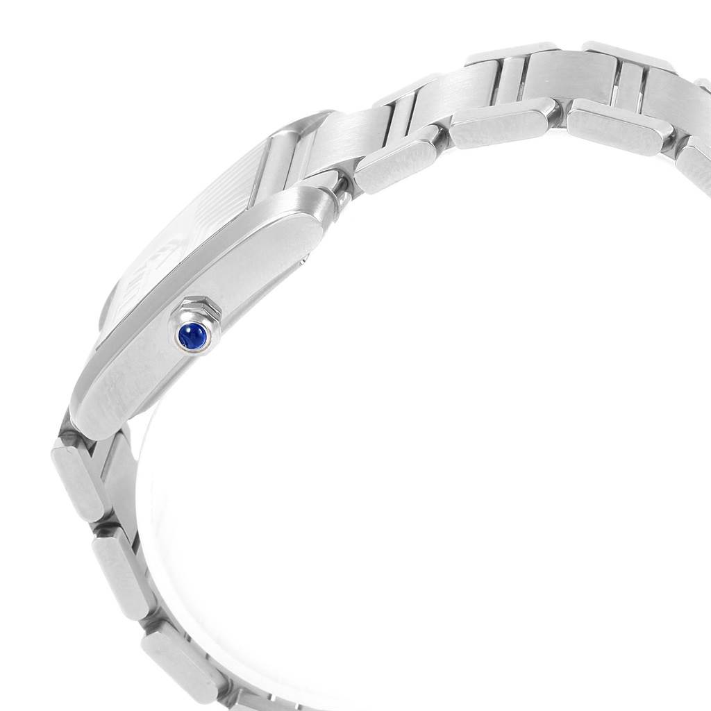 The image shows a side view of the Cartier Tank Francaise W51002Q3 Men
s Stainless Steel Silver Dial W51002Q3 Men
s Stainless Steel Silver Dial watch, highlighting the bracelet and the crown with a blue gemstone.