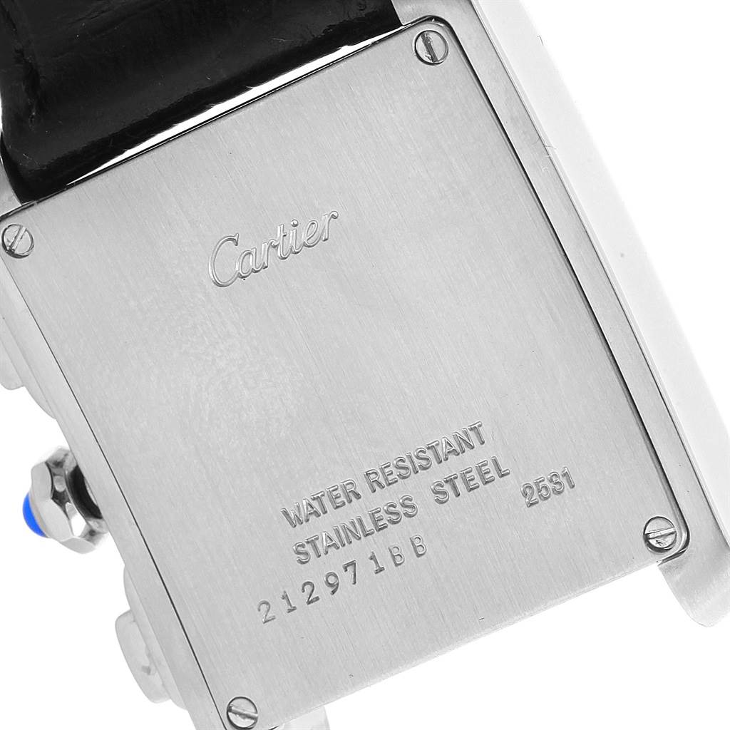 The image shows the back case of a Tank Française model by Cartier, highlighting the brand engraving and water resistance details.