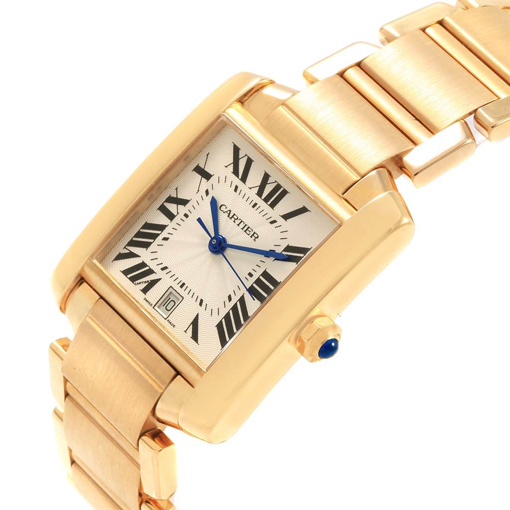 This image shows the front and part of the bracelet of the Cartier Tank Francaise W50001R2 Yellow Gold Silver Dial W50001R2 Yellow Gold Silver Dial watch at a slight angle.