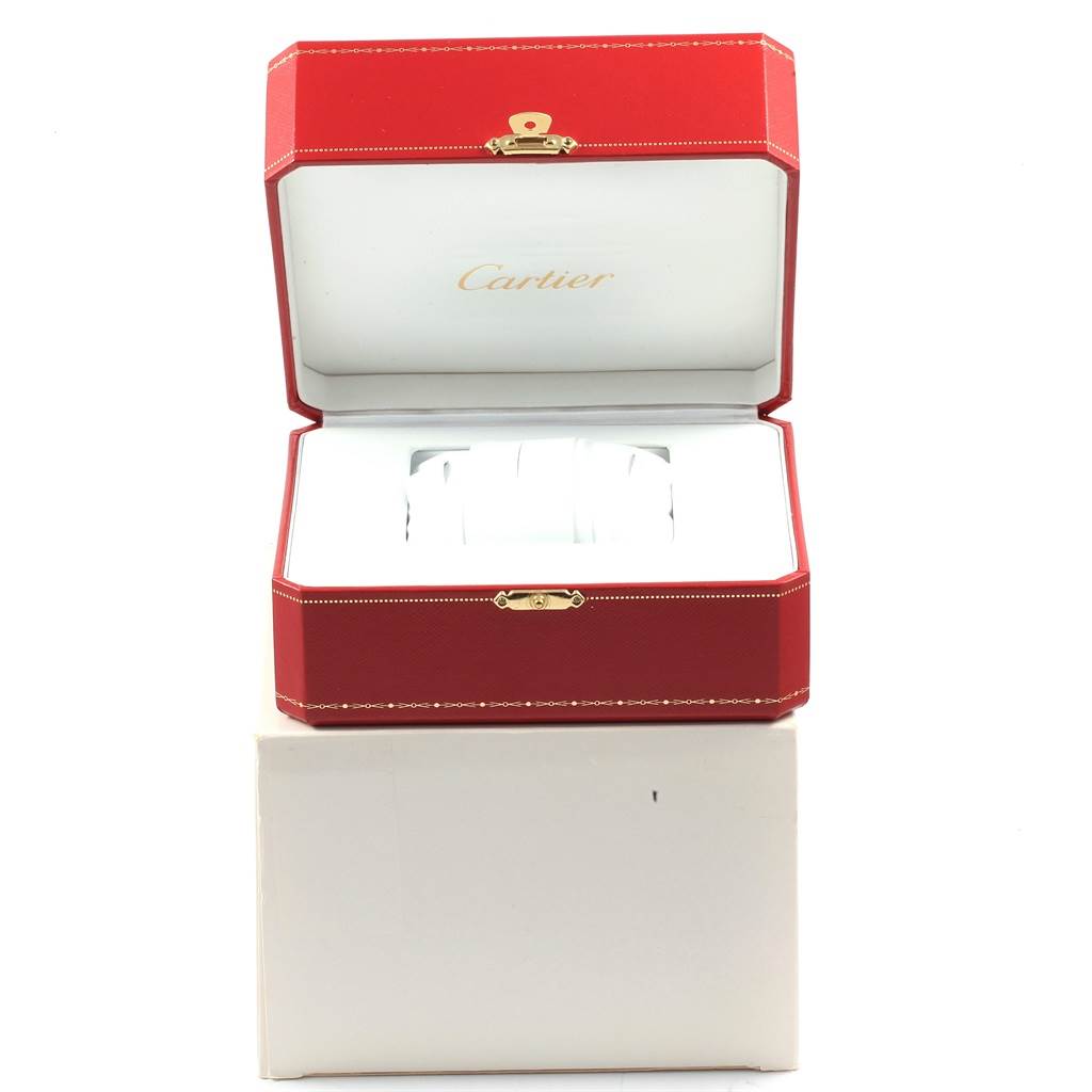 The image shows an open box for a Cartier Tank Francaise W50001R2 Yellow Gold Silver Dial W50001R2 Yellow Gold Silver Dial watch, highlighting the brand logo and inner cushion.
