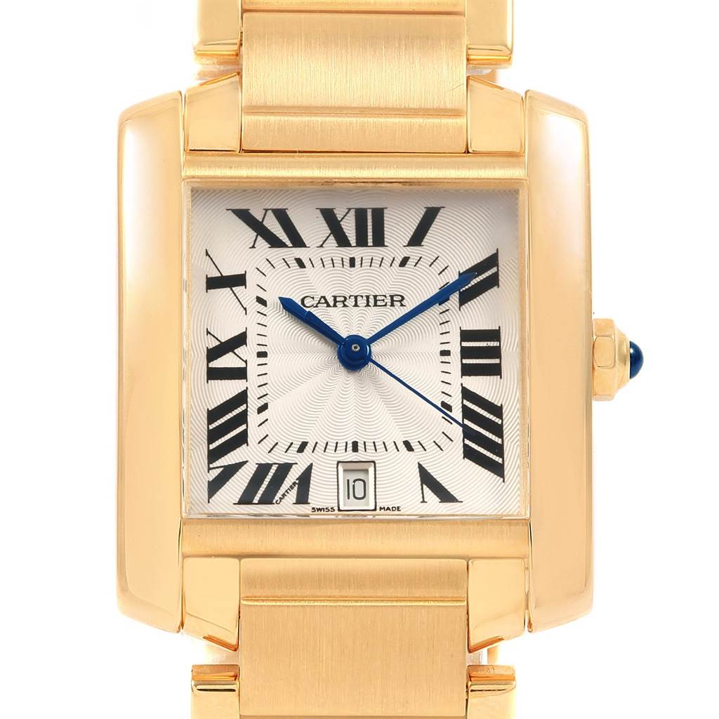 The image shows a frontal view of the Cartier Tank Francaise W50001R2 Yellow Gold Silver Dial W50001R2 Yellow Gold Silver Dial watch, highlighting its gold case, Roman numerals, and blue hands.