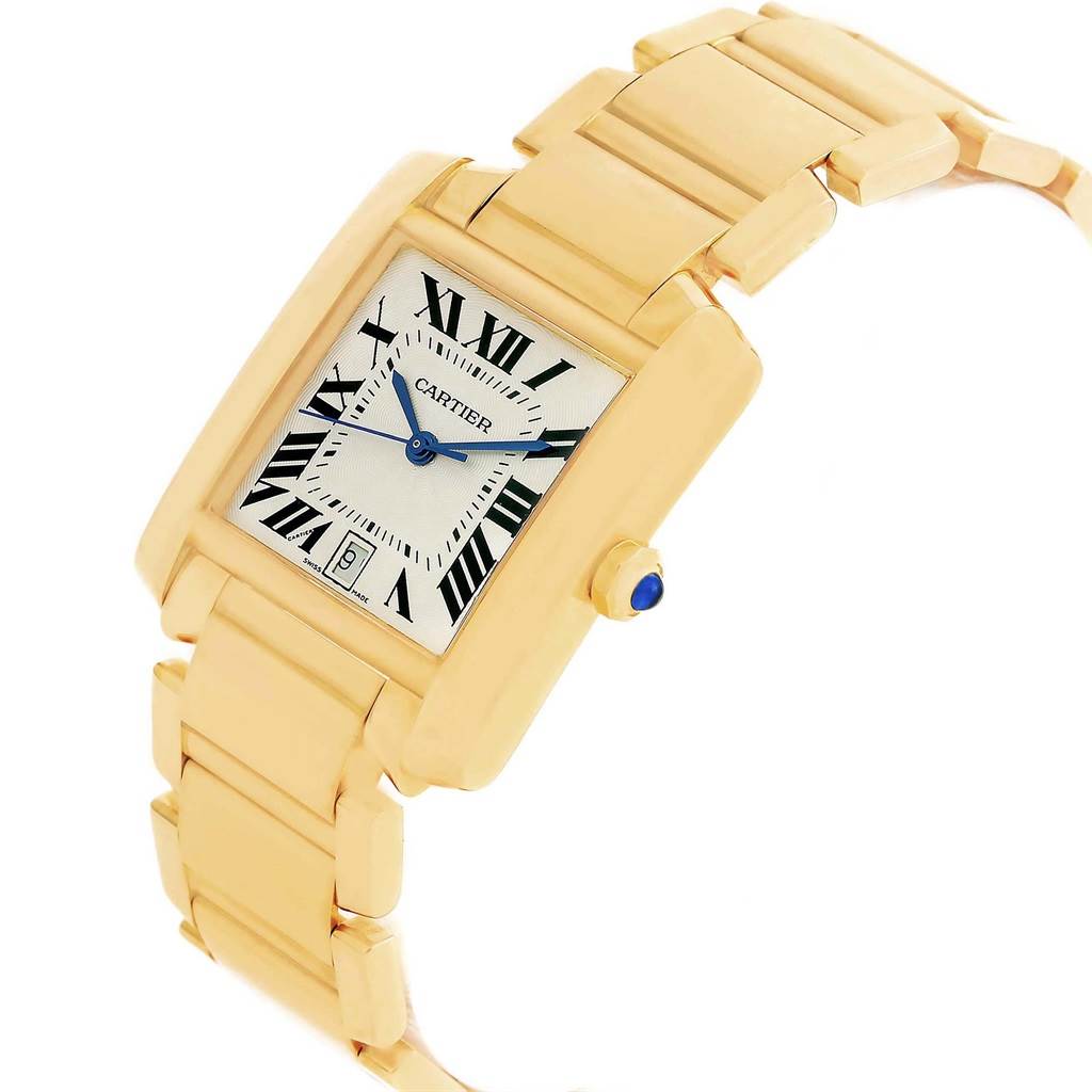 The Tank Francaise by Cartier is shown at an angled view, highlighting its rectangular dial, Roman numerals, and bracelet.
