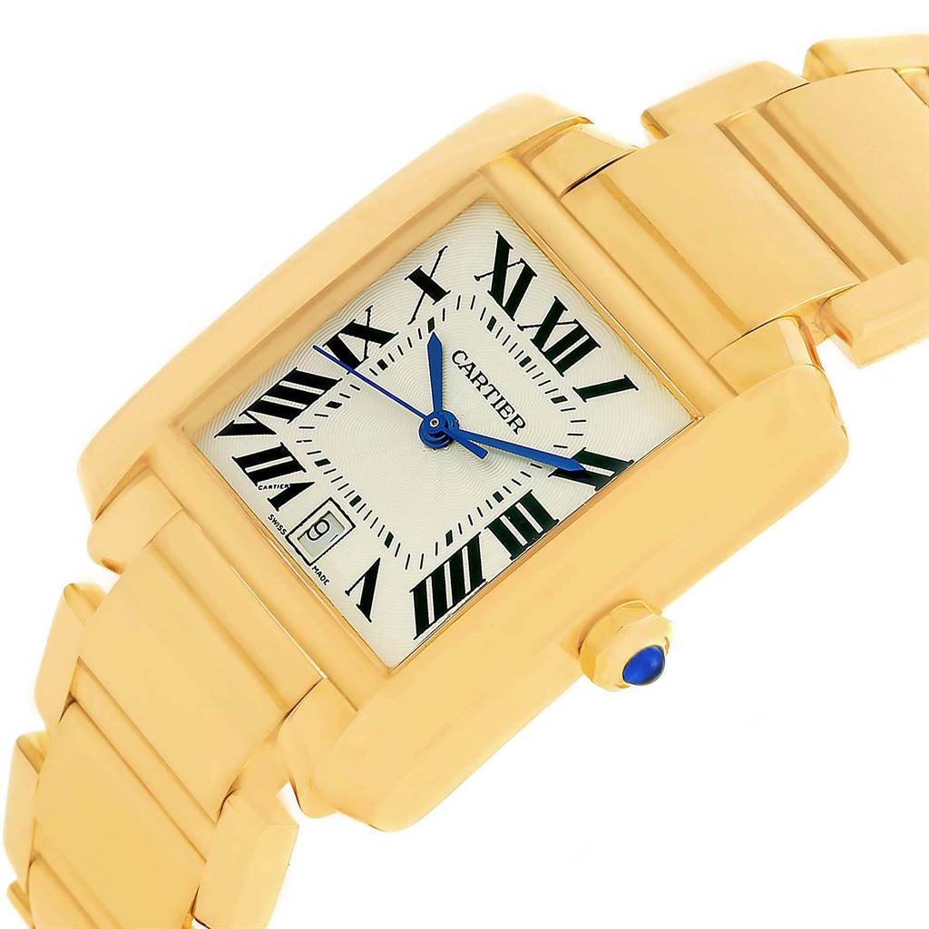 The image displays a Cartier Tank Francaise W50001R2 Yellow Gold Silver Dial W50001R2 Yellow Gold Silver Dial watch at an oblique angle, featuring its gold rectangular case, bracelet, and blue hands.