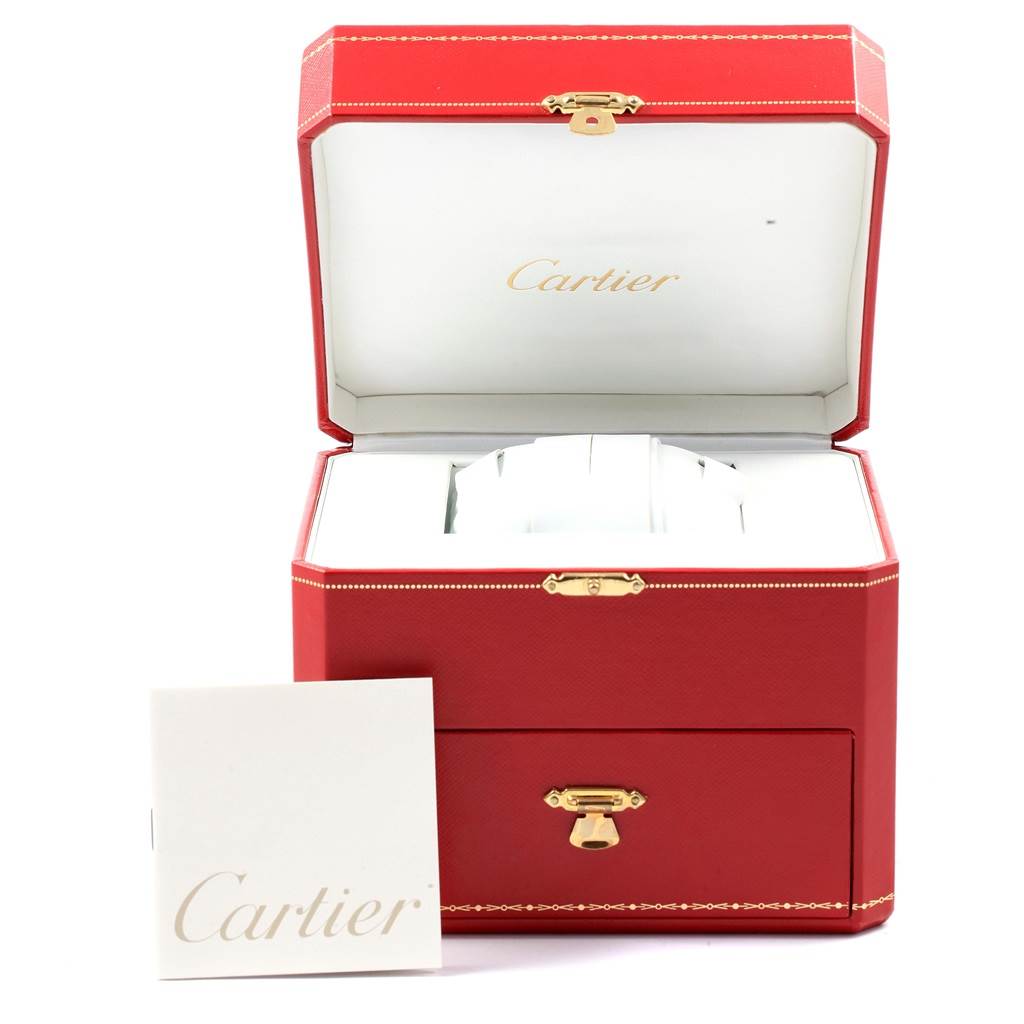 The image shows an open red Cartier watch box with a Tank Francaise booklet placed in front.