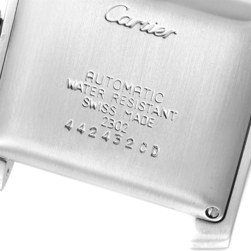 This image shows the back of a Cartier Tank Francaise W51002Q3 Stainless Steel Silver Dial W51002Q3 Stainless Steel Silver Dial watch, displaying its engraved details and serial number.