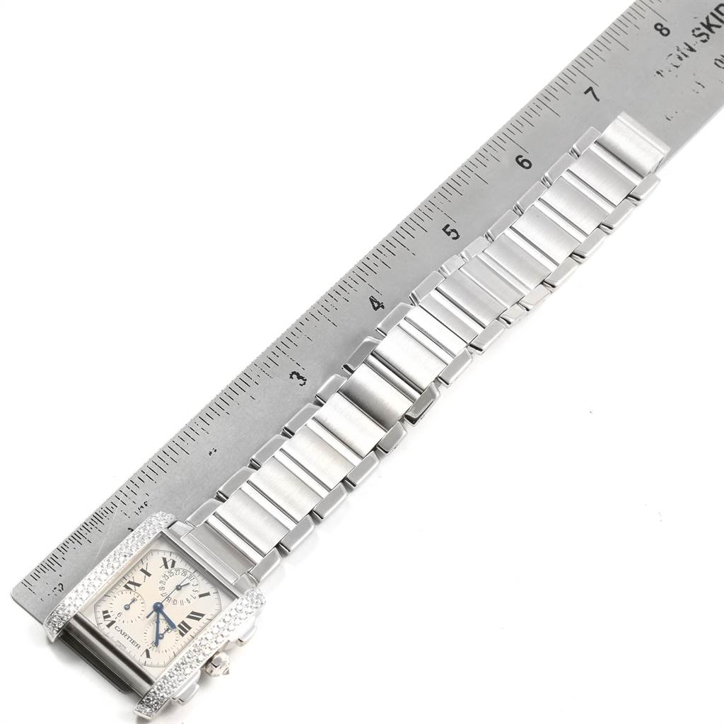 The image shows a side view of the Cartier Tank Francaise 2367 Men's White Gold Silver Dial 2367 Men's White Gold Silver Dial watch with a ruler measuring the length of its metal bracelet.